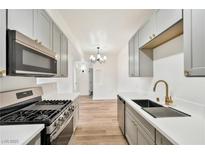 Modern kitchen features stainless steel appliances, updated cabinets and countertops, and stylish fixtures at 3318 N Decatur Blvd # 1107, Las Vegas, NV 89130