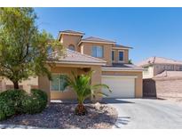 Inviting two-story home featuring a well-manicured yard and a convenient two-car garage at 3615 Dutchmans Vine Ct, North Las Vegas, NV 89081