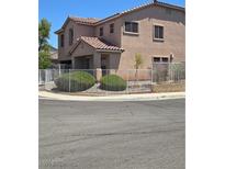Charming two-story home with a well-maintained front yard and a secure white metal fence at 3954 Crystal Trip Ct, Las Vegas, NV 89129