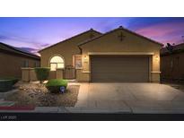 Charming single-story home with a well-manicured front yard and a two-car garage in a residential neighborhood at 4062 Vulcan St, Las Vegas, NV 89122