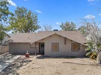 Charming single-story home features a neutral exterior, a brick pathway, and a tidy roofline at 5101 Churchill Ave, Las Vegas, NV 89107