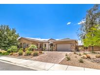 Charming single-story home with a well-manicured front yard and a brick driveway at 7111 Bath Dr, Las Vegas, NV 89131