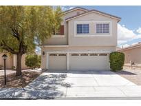 Inviting two-story home featuring a spacious three-car garage and well-maintained landscaping at 9029 Tumblewood Ave, Las Vegas, NV 89143