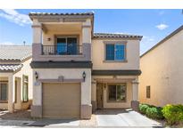 Charming two-story home featuring a balcony, covered entry, and attached garage at 9613 Eland Ct, Las Vegas, NV 89149
