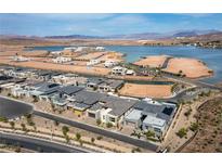 Gorgeous aerial view of a lakeside community featuring modern homes and scenic views at 104 Tre Pietre St, Henderson, NV 89011