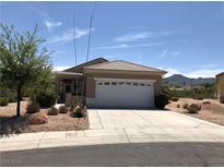 Charming single-story home featuring a two-car garage and desert landscaping at 1396 Couperin Dr, Henderson, NV 89052