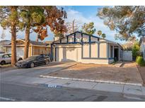 Charming single-story home featuring a two-car garage and xeriscaped front yard at 1728 S Christy Ln, Las Vegas, NV 89142