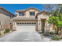 Charming two-story home with a well-maintained front yard and a two-car garage at 216 Sharp Edge Ave, North Las Vegas, NV 89031