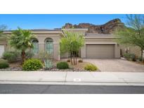 Inviting single-story home with desert landscaping and attached two car garage at 26 Costa Tropical Dr, Henderson, NV 89011