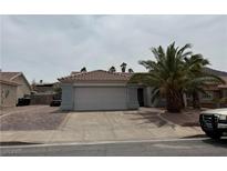 Charming single-story home with a well-maintained front yard and a two-car garage at 341 Waterwheel Falls Dr, Henderson, NV 89015