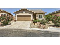 Charming single-story home featuring a well-maintained front yard with desert landscaping and an attached garage at 3642 Winter Whitetail St, Las Vegas, NV 89122