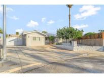 Charming single-story home with a well-manicured front yard and a long driveway at 5453 Yvonne Cir, Las Vegas, NV 89122