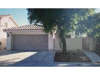 Charming single-Gathering home featuring a two-car garage and gated entrance at 7705 Sanction Ave, Las Vegas, NV 89131