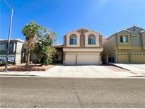 Charming two-story home featuring a neutral color scheme and a spacious two-car garage, ideal for families at 8125 Rio De Janeiro Dr, Las Vegas, NV 89128
