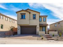 Charming two-story home featuring desert landscaping, a two-car garage, and a welcoming front porch at 89 Via Franello, Henderson, NV 89011