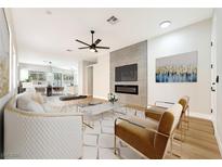 Inviting living room featuring a modern fireplace and stylish furnishings at 10017 Snow Crest Pl, Las Vegas, NV 89134