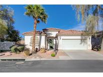 Charming single-story home featuring desert landscaping, a tile roof, and an attached two-car garage at 10518 Santerno St, Las Vegas, NV 89141