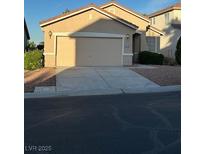 Single-Gathering home featuring a two-car garage, low-maintenance landscaping, and neutral-colored exterior at 3416 Mountain Park St, Las Vegas, NV 89129