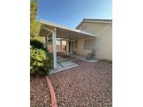 View of a covered patio, featuring a concrete walkway and gravel, great for outdoor seating at 3416 Mountain Park St, Las Vegas, NV 89129
