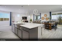 Spacious open kitchen with a large island, stainless steel appliances, and eat in dining area at 390 Arizona St # Lot 9, Boulder City, NV 89005