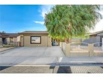 Charming single-story home featuring a spacious driveway and mature shade tree at 520 Prince Alan Ct, Las Vegas, NV 89110