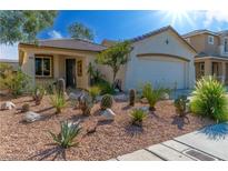 Charming single story home with drought resistant landscaping, and an attached two car garage at 669 Elliot Peak Ave, Las Vegas, NV 89183