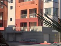 Exterior view of a multi-story condo building with balconies and colorful architectural details at 87 E Agate Ave # 202, Las Vegas, NV 89123