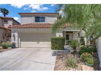 Charming two-story home featuring a well-manicured yard and attached two-car garage at 1305 Chaparral Summit Dr, Las Vegas, NV 89117