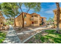 Well-maintained exterior with walkways and landscaping under a sunny blue sky at 3135 S Mojave Rd # 113, Las Vegas, NV 89121