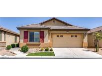 Charming single-story home with a well-manicured lawn and a two-car garage at 3720 Rocklin Peak Ave, North Las Vegas, NV 89081