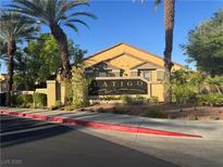 View of the Latigo community entrance sign flanked by mature palm trees and lush landscaping at , Las Vegas, NV 89183
