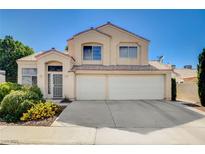 Charming two-story home with a three-car garage and well-maintained landscaping at 1333 Date Palm Cir, Las Vegas, NV 89108