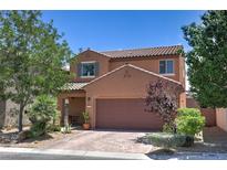 Charming two-story home showcasing a well-maintained front yard and inviting curb appeal at 2373 Rue Royale St, Henderson, NV 89044