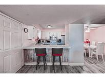 Charming kitchen features a breakfast bar with seating, and a view of the dining area at 2725 S Nellis Blvd # 1038, Las Vegas, NV 89121