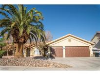Charming single-story home with a well-maintained yard, a mature palm tree, and a two-car garage at 3436 N Tenaya Way, Las Vegas, NV 89129