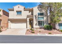 Charming two-story home features a manicured front yard, two-car garage, and tile roof at 4016 Owlshead Mountain St, Las Vegas, NV 89129