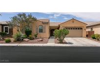 Charming single-story home with a well-maintained yard and attached two car garage at 6929 Homing Pigeon Pl, North Las Vegas, NV 89084