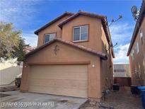 Two-story home with a two car garage and a well-maintained exterior at 7464 Edgecove Ct, Las Vegas, NV 89139