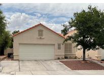 Charming single-story home with well-maintained stucco, red tile roof and a spacious two car garage at 7620 Donald Nelson Ave, Las Vegas, NV 89131