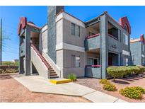 Well-maintained apartment complex with neat landscaping and exterior stairs leading to upper units at 8600 W Charleston Blvd # 2187, Las Vegas, NV 89117