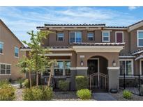 Charming two-story townhome featuring a gated front porch and desert landscaping for easy maintenance at , Henderson, NV 89044