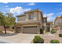 Inviting two-story home featuring a three car garage and manicured landscaping with a beautiful stone facade at 10680 Sapphire Vista Ave, Las Vegas, NV 89144