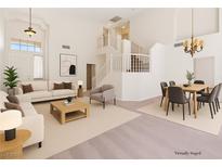 Bright living room featuring high ceilings, neutral tones, and ample natural light, creating a welcoming atmosphere at 10680 Sapphire Vista Ave, Las Vegas, NV 89144