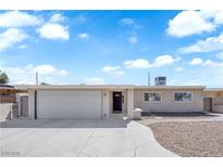 Charming single-story home with a well-maintained front yard and a two-car garage at 1628 Patricia St, North Las Vegas, NV 89030