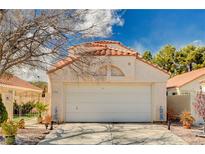 Charming single-story home featuring a terracotta tile roof and a two-car garage at 1721 Derbyshire Dr, Las Vegas, NV 89117
