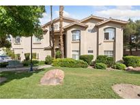 Beautiful home exterior with a well manicured lawn and desert landscaping at 2050 W Warm Springs Rd # 224, Henderson, NV 89014
