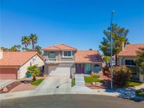 Charming two-story home with a well-maintained front yard and lovely landscaping at 2080 Silver Breeze Ave, Las Vegas, NV 89183