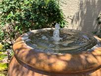 Inviting outdoor water feature adds a touch of tranquility to the home's exterior landscaping at 2728 Aspen Wood Ave, Henderson, NV 89074