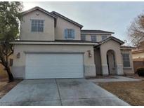 Charming two-story home with a spacious two-car garage and concrete driveway at 3021 New Journey Way, North Las Vegas, NV 89031