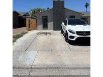 Charming single story home featuring a xeriscaped front yard with a freshly painted facade and a long driveway at 4732 El Tesoro Ave, Las Vegas, NV 89121